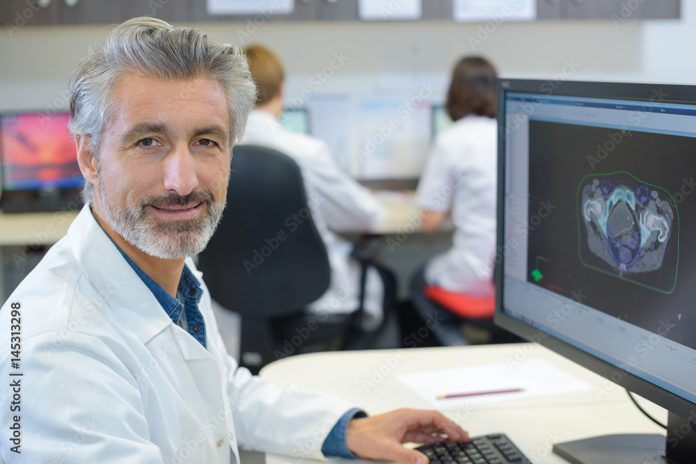 Portrait of male healthworker using computer
