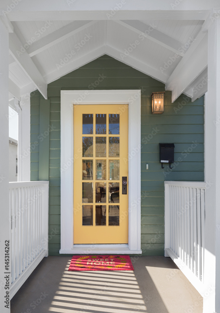 Fototapeta premium House entrance with yellow glass door