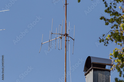 antenna and powerline on roof photo