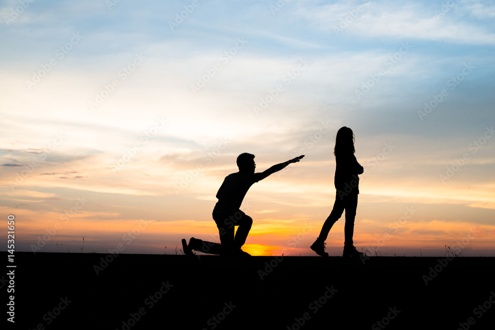 Silhouette of couple upset,man and women are quarrel in sunset time.