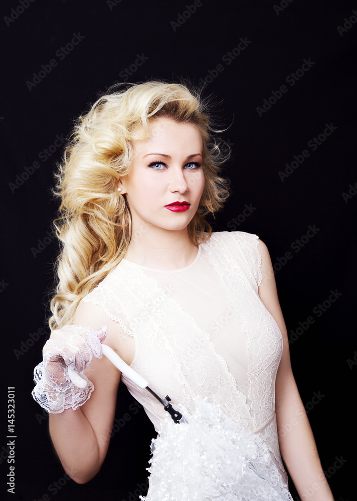 Young gorgeous blonde woman with white umbrella on a dark background Young gorgeous blonde woman with white umbrella on a dark background