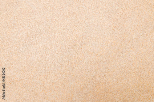 Beige brown suede soft leather as texture background.