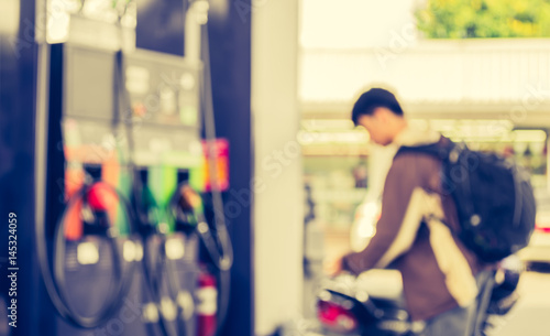 blur gas station on day time . © coffmancmu