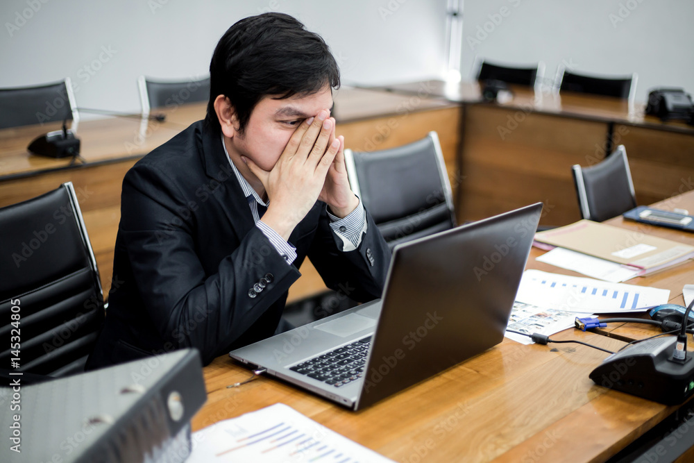 businessman tired or stressed in the office after his work. stressed businessman concept. businessman tired or stressed in the office after his work. stressed businessman concept.