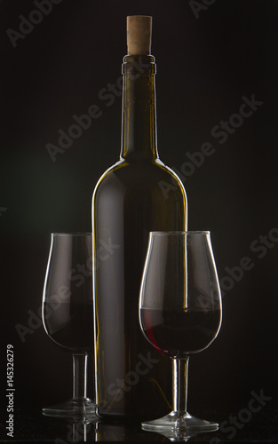 877442 Bottle of wine and vine glass photo