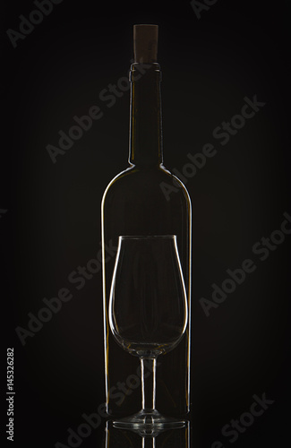 877445 Bottle of wine and vine glass photo