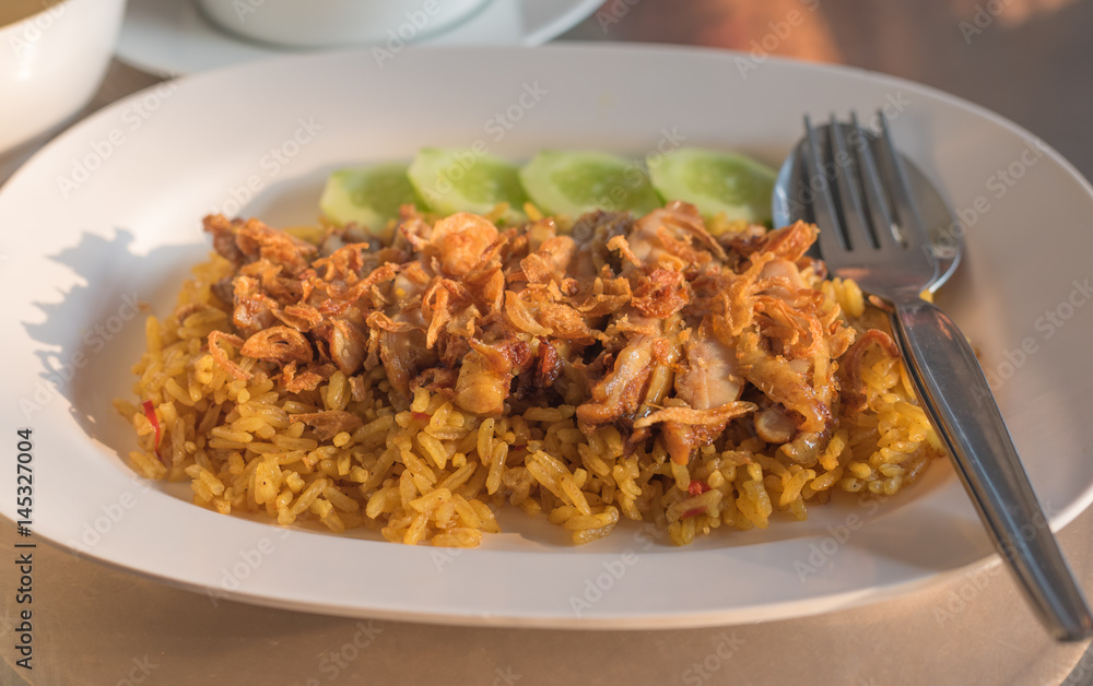 Chicken Biryani with green chutney in dish Chicken Biryani with green chutney in dish
