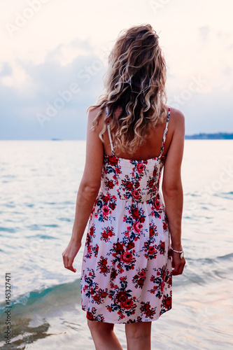 Woman standing on the beach