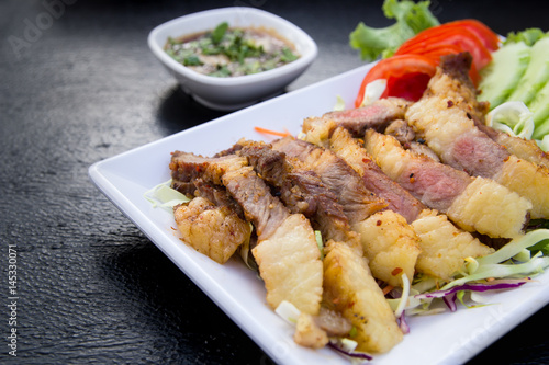 Grilled beef steak sliced with source , Thai Food