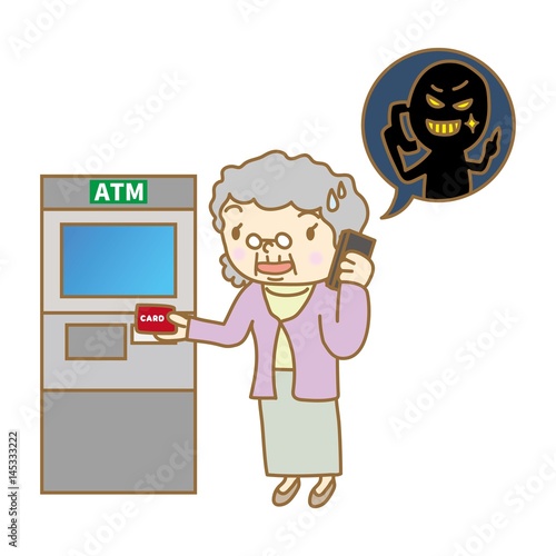 ATM前で電話をするシニア女性
