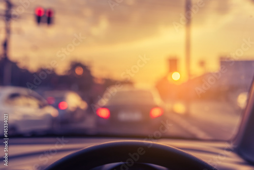 vintage tone blur image of people driving car on day time.