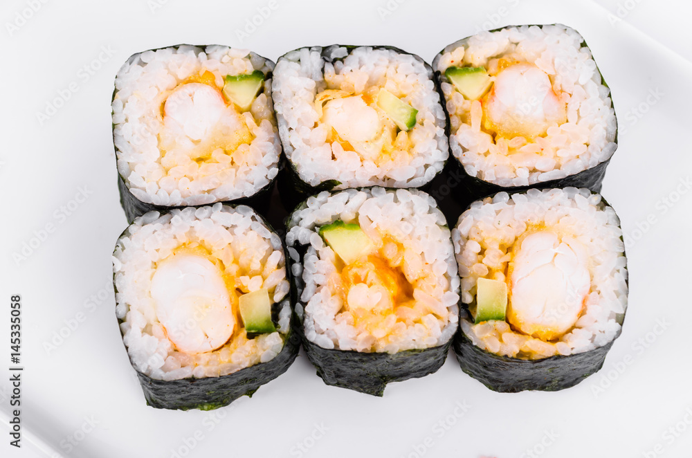Asia. Rolls with shrimp on a white plate on a white background Asia. Rolls with shrimp on a white plate on a white background
