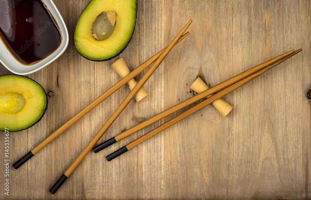 chopsticks and soy sauce on wooden table background with copy space chopsticks and soy sauce on wooden table background with copy space