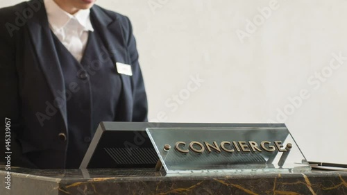 Close up on receptionist answering call
