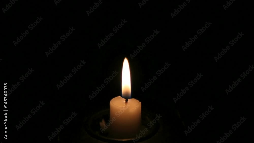 Cinemagraph Burning Candle in the Dark. High Definition Video Clip.