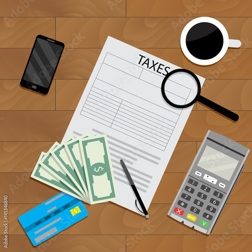 Business table with coffee and tax form