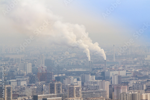 Smoke coming out of two factory chimneys