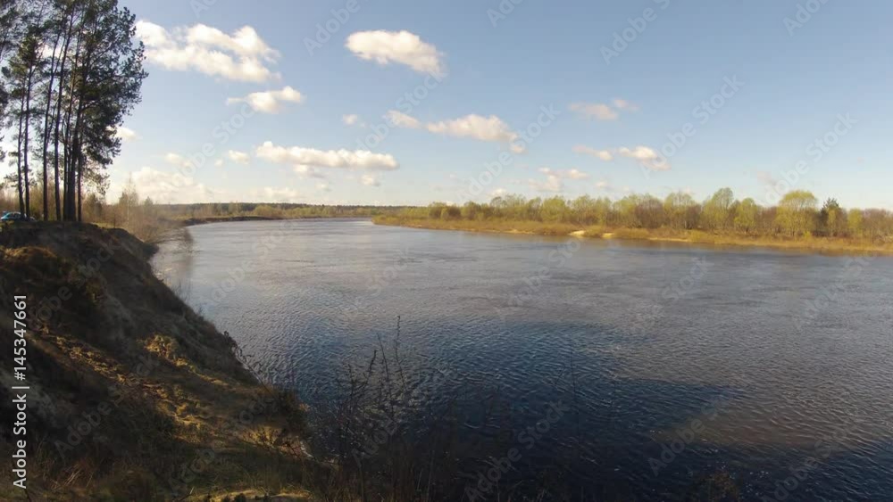 Time-lapse. Clouds are running over the river. Time-lapse. Clouds are running over the river.