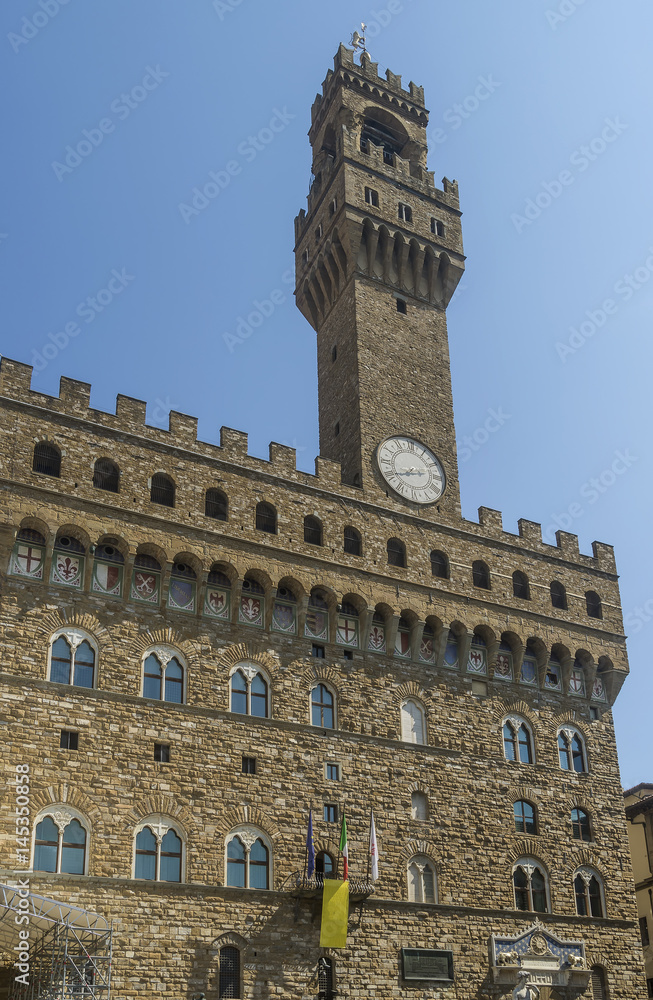Detail of the famous Palazzo Vecchio in Piazza della Signoria, historic center of Florence, Italy, on a sunny day