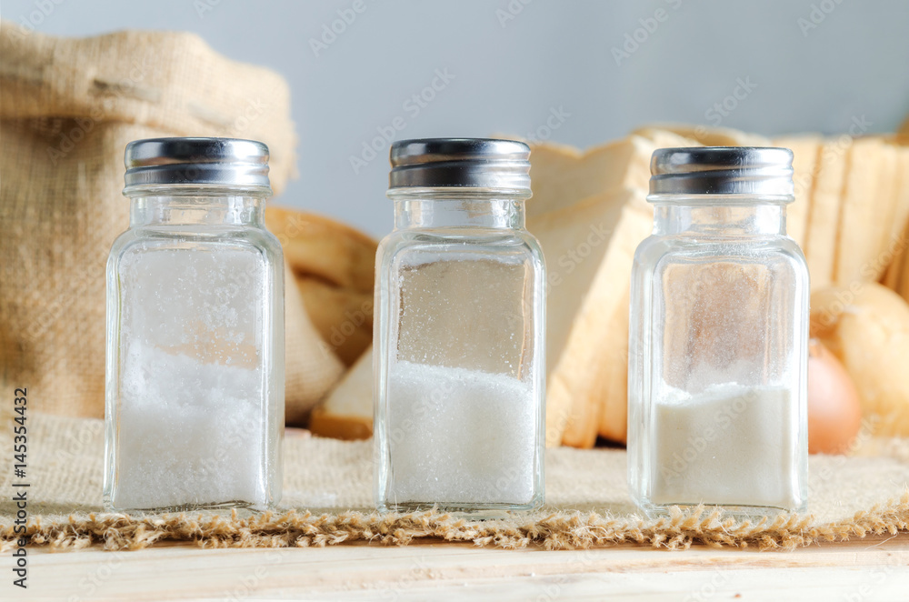 Bottle of salt sugar and wheat flour with bakery ingredient Bottle of salt sugar and wheat flour with bakery ingredient