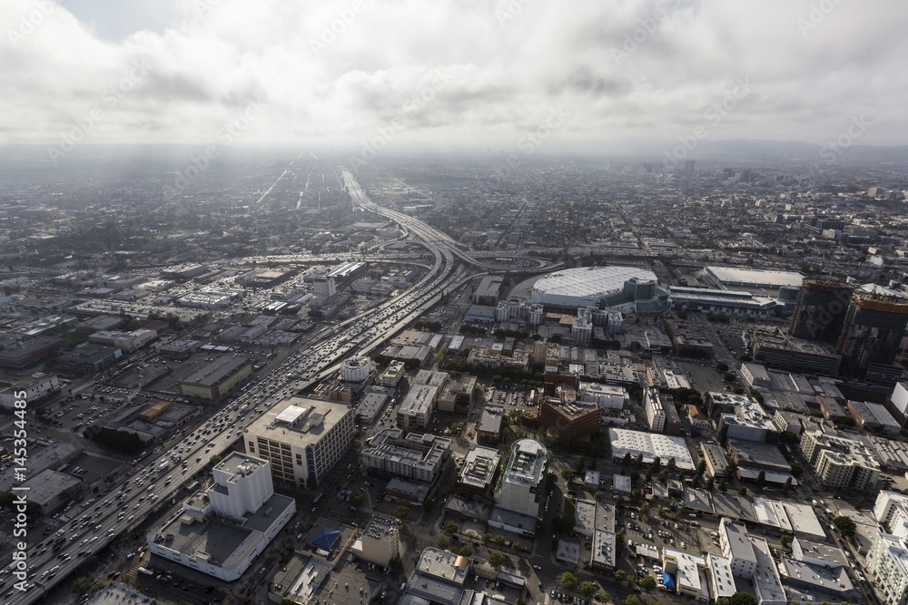 Obraz premium Aerial view of Los Angeles 10 and 110 freeways with afternoon clouds in Southern California. 