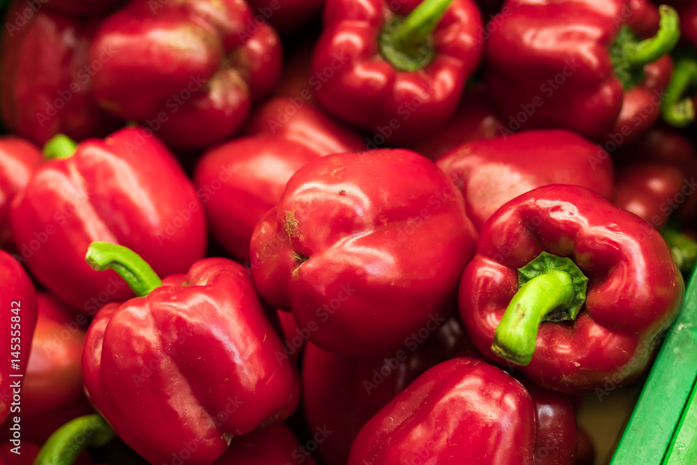 Fresh red organic sweet bell peppers on the farmer market on a tropical island Bali, Indonesia. Organic background.