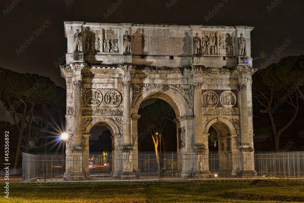 Arch of Constantine near the Colosseum at night.