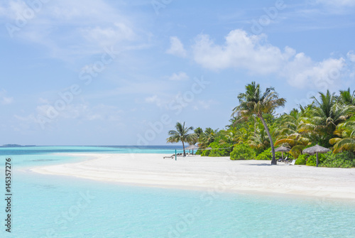 Tropical sand beach and blue sky with white clouds
