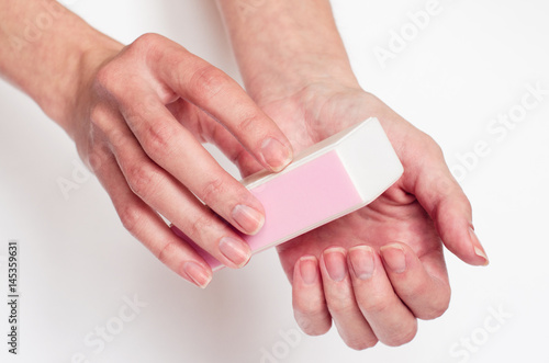 Filling nails on the light background