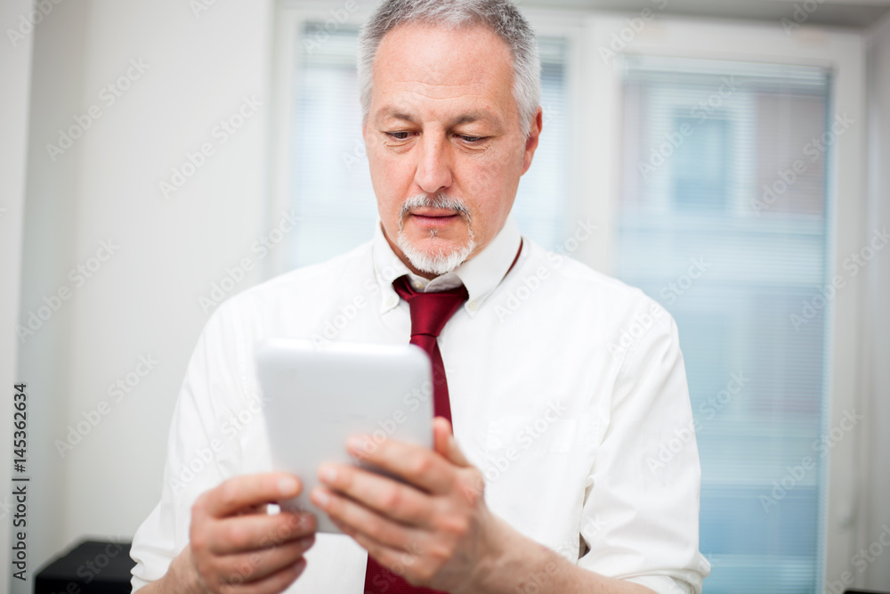 Portrait of a man using a digital tablet Portrait of a man using a digital tablet