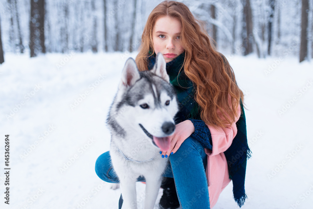 Female master on dog training with siberian husky