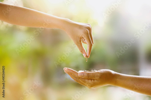 hand giving money for investment the future