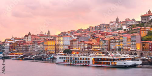 Panorama of Ribeira, Old town of Porto and the Douro River at pink sunset, Portugal, Portugal.