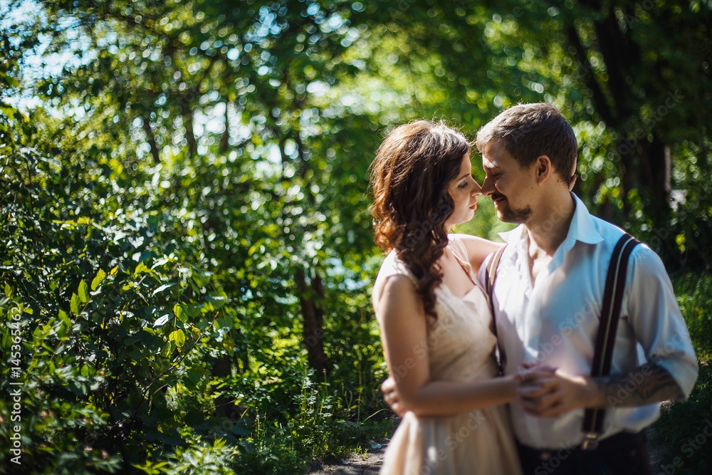 a young couple walks in the Park on a sunny day a young couple walks in the Park on a sunny day