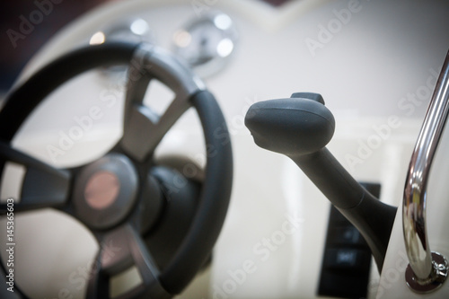 Lever and steering wheel on a boat © bizoo_n
