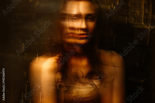 Portrait of Beautiful girl with wet hair and bare shoulders with blur