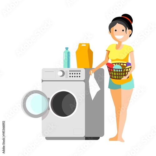 Cheerful woman putting clothes to washer