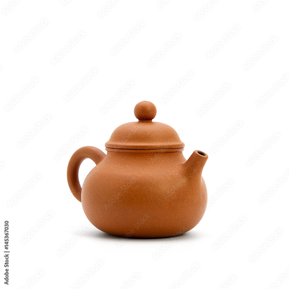 small earthenware bowl and tea on white background