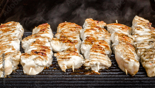 Different kinds of meat, kebab on skewers. Street festival food.