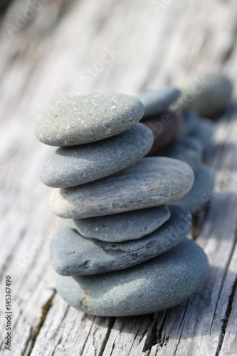 Balancing pebbles on the beach