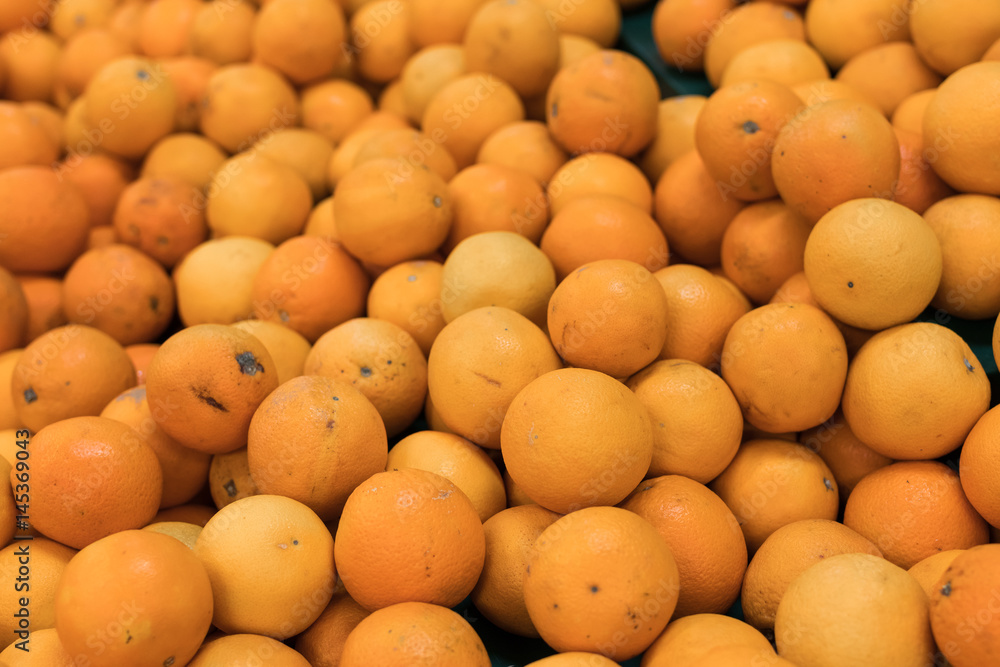 Fresh oranges on a local organic farm market on a tropical Bali island, Indonesia. Oranges background.