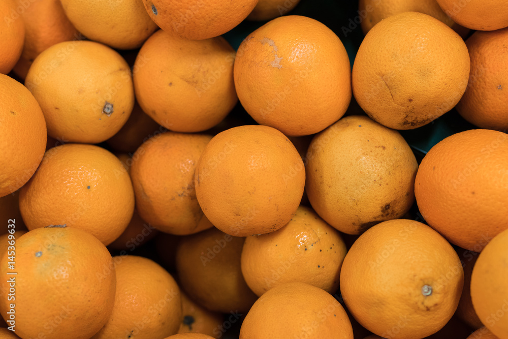Fresh oranges on a local organic farm market on a tropical Bali island, Indonesia. Oranges background. Fresh oranges on a local organic farm market on a tropical Bali island, Indonesia. Oranges background.