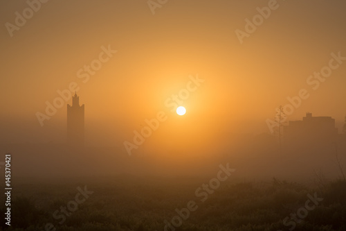 Sunrise over the mosque in the Moroccan village