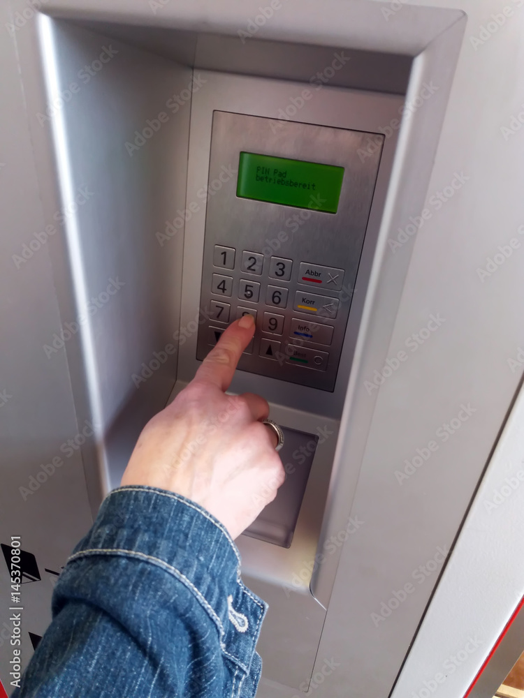 Human hand pressing the numbers on the machine for sale Human hand pressing the numbers on the machine for sale