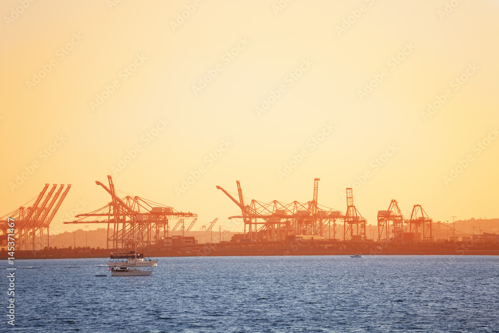Long Beach shipping port with cranes at sunset