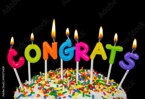congrats candles on cake with colorful sprinkles