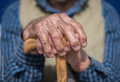 Old Man Hands with cane photo