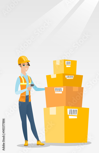 Warehouse worker scanning barcode on box.