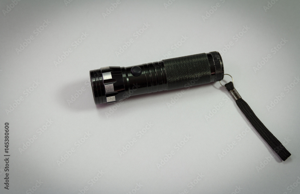 Fototapeta premium Black police flashlight isolated on white background