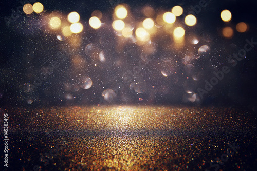 Fényképezés glitter vintage lights background. gold and black
